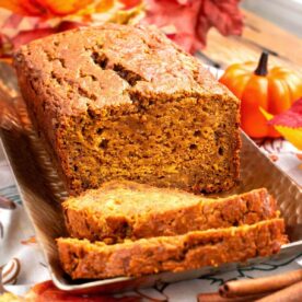 loaf of pumpkin banana bread partially sliced