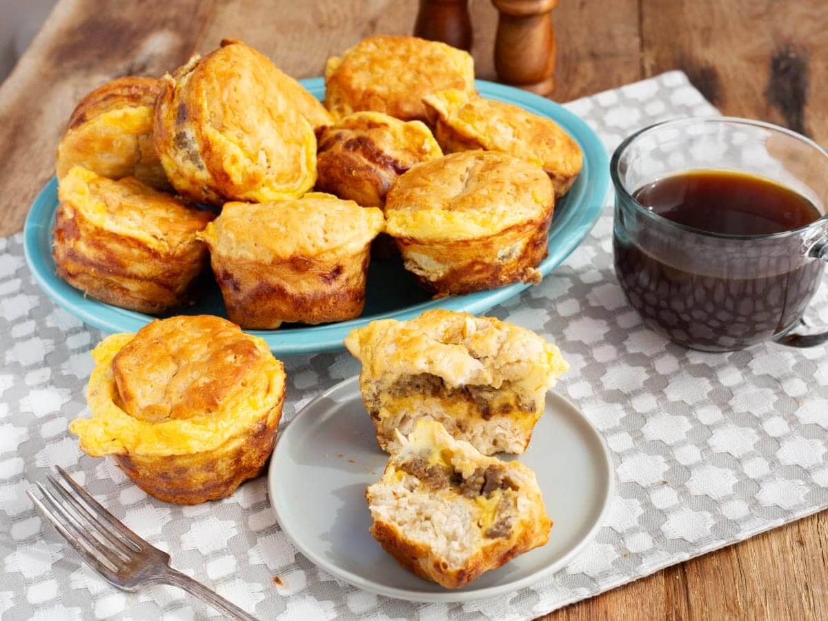 sausage egg and cheese biscuit muffins on a blue platter