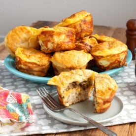sausage egg and cheese biscuit muffins on a blue platter