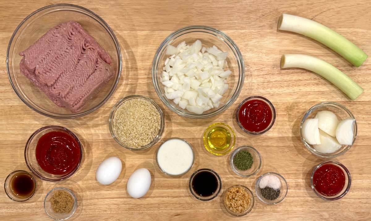 Ingredients for Halloween Feet Loaf, including ground turkey, panko breadcrumbs, eggs, onion, leek, ketchup, and seasonings.