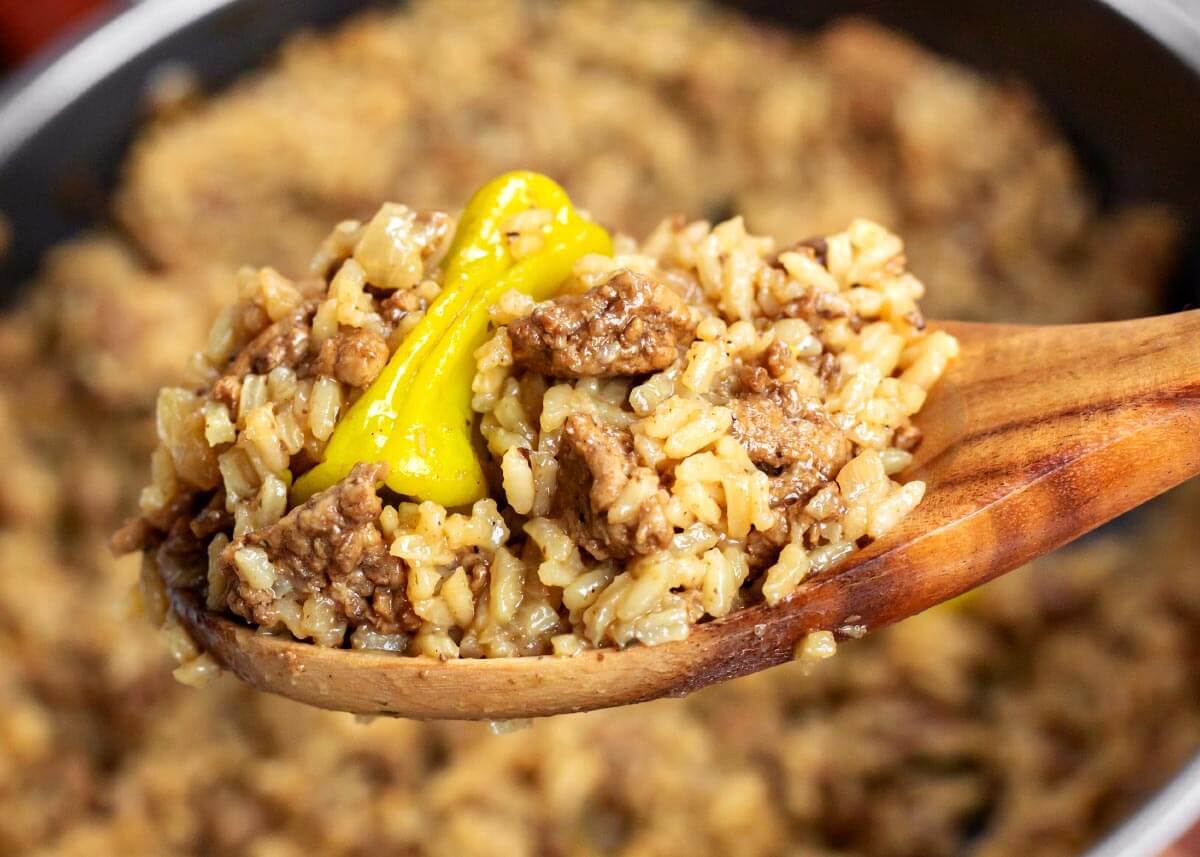 mississippi ground beef and rice on a wood spoon
