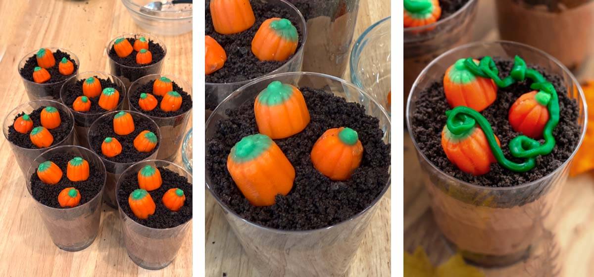 Halloween dirt cups decorated with orange candy pumpkins and green icing piped into curly pumpkin vines