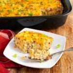 Sausage hashbrown breakfast casserole with a plated serving