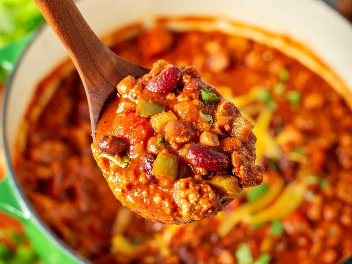 wooden ladle full of wendy's style chili