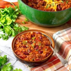 green pot and bowl of chili